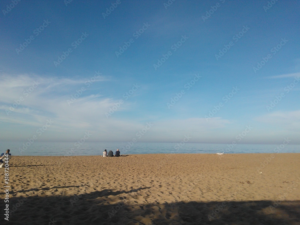 calm beach, blue sky and sea, soft sand