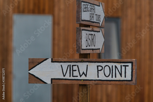 Old wooden viewpoint sign on a tourist trail