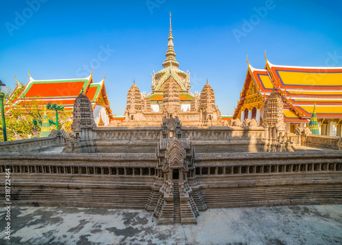 Angkor Wat Model with Phra Sawet Kudakhan Wihan Yot at Wat Phra Kaew (Temple of the Emerald Buddha) within Grand Palace Area in Bangkok, Thailand photo