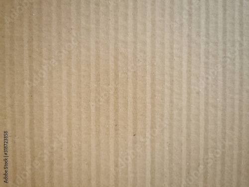The brown paper background. Abstract cardboard background. 
