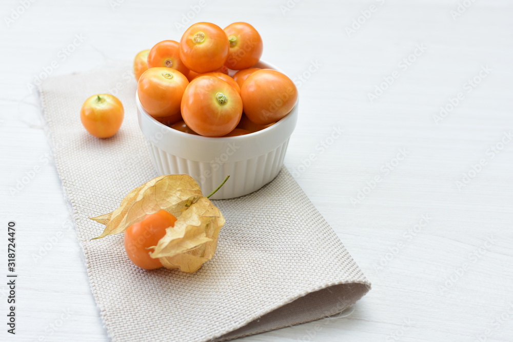 natural cape gooseberry on wooden background natural cape gooseberry on wooden background