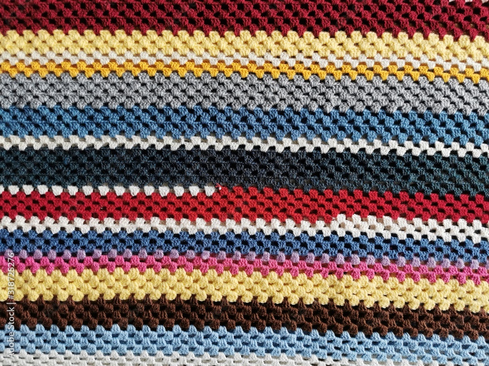 Home made colored crochet blanket. Strips Backgrounds. Home made colored crochet blanket. Strips Backgrounds.