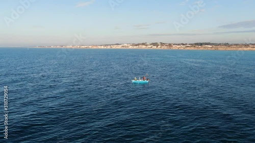 Fishermen on the small boat, in the sea 7