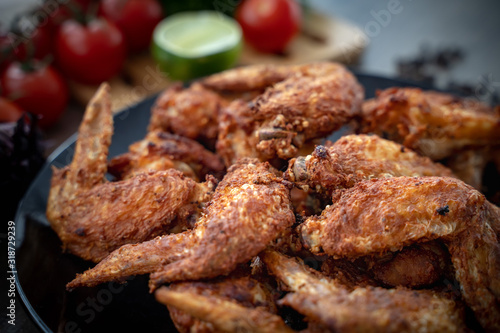 Hot Meat Dishes - Fried Chicken Wings on plate with salad