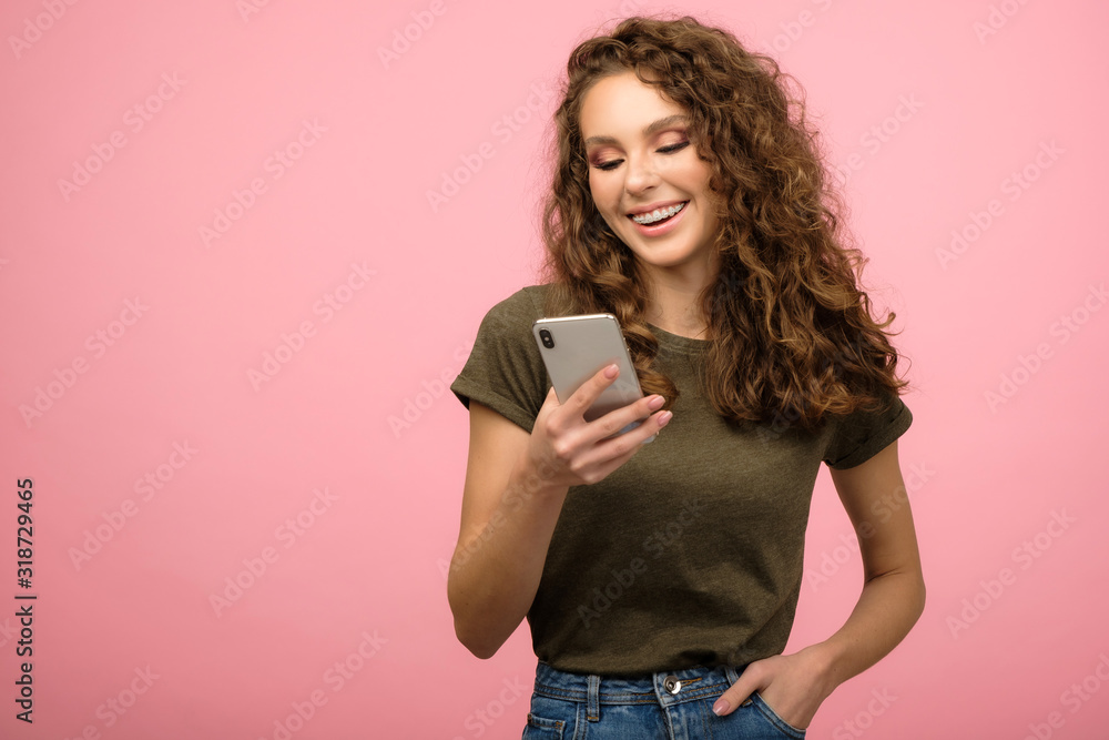 Closeup studio portrait of pretty student with smartphone Closeup studio portrait of pretty student with smartphone