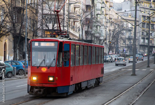 Vibrant red tramway in city