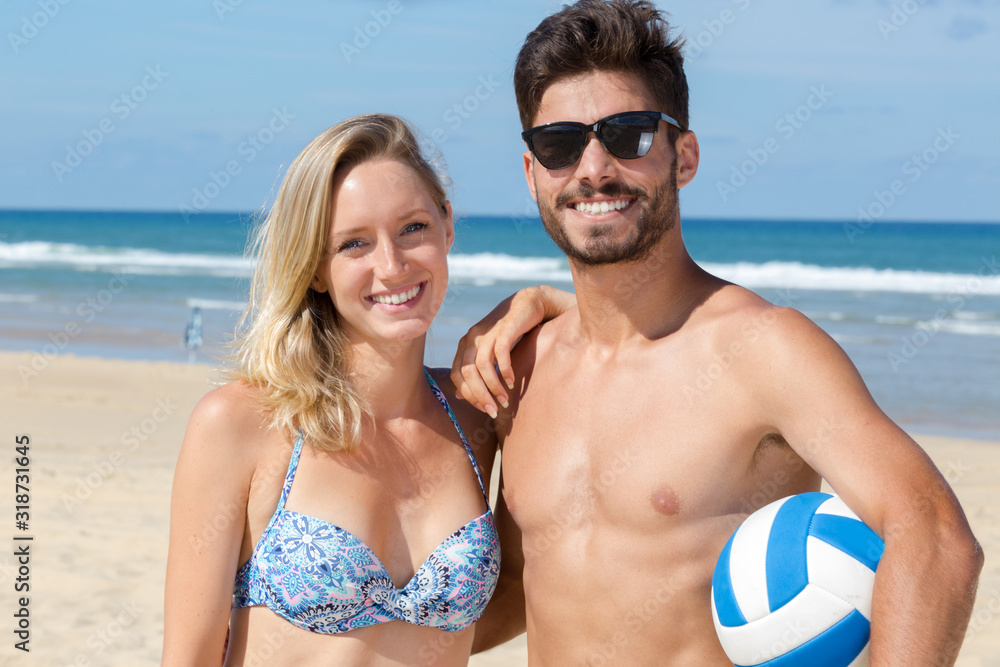 Fototapeta premium happy young couple having fun on the beach