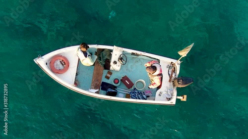 Fishermen on the small boat, in the sea 5