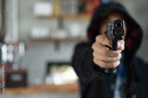 man pointing a gun at the target