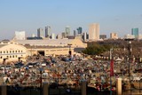 Bustling grounds of the stock show and rodeo in Fort Worth with the city's skyline in the background