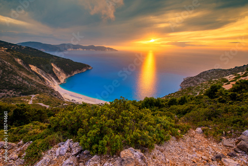 Fototapeta Naklejka Na Ścianę i Meble -  Beautiful summer sunset on Mirtos beach in Greece