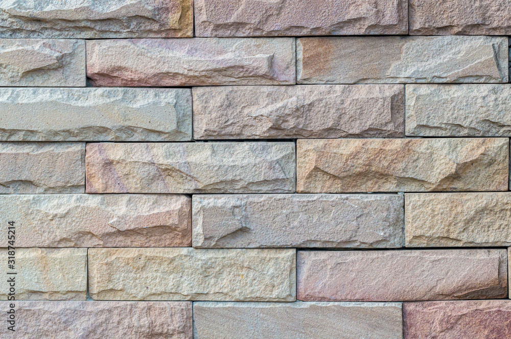 Fototapeta premium Modern brick wall. Multicolored Tile Background-brown and white color. Pattern of modern brick wall. Mosaic stone tile wall texture pattern background. Marble texture decorative brick.