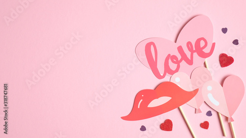 Valentine's day card template with elegant decorations on pink background with copy space. Flat lay, top view. Happy Valentines Day banner, greeting card mockup. Love and romance concept.