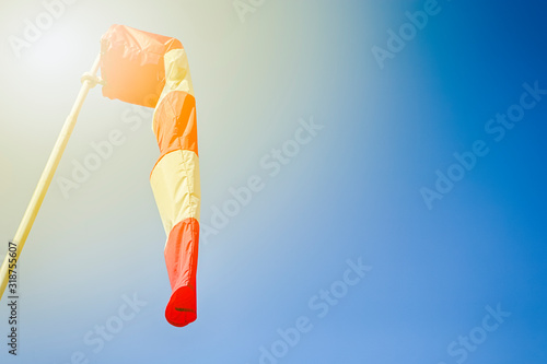 Tranqiul Windsock Against Blue Sky With Bright Sunlight. photo