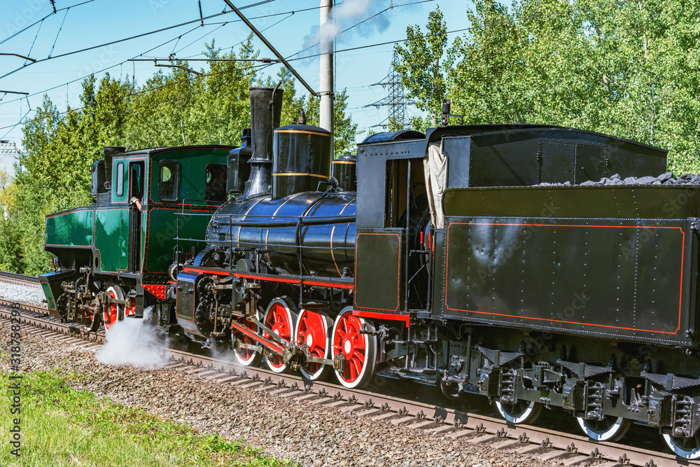 Naklejka premium Retro steam locomotives at sunny day time.