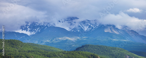 Panoramic view of the peaks in the clouds