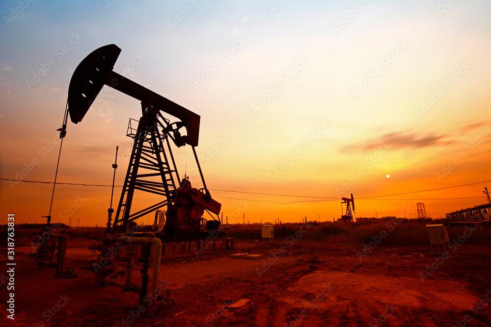 Sunset time of oil pump, oil industry equipment