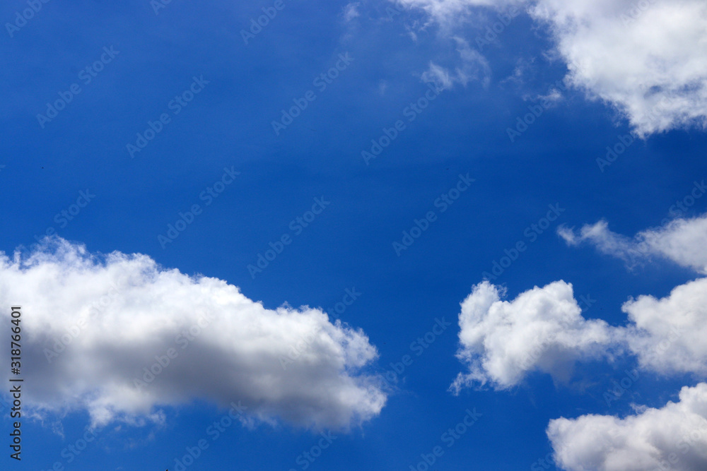 Obraz premium blue sky white space cloud background with light bright of sun. weather at day and sky clear and sunlight. view blue sky weather in summer and air beauty