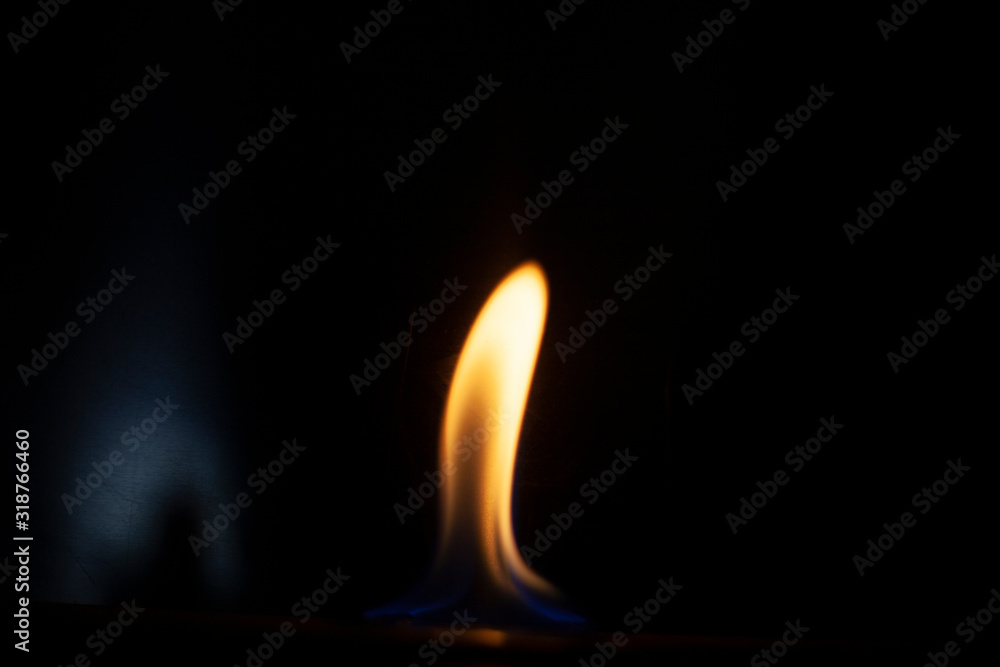 Tongue of fire flame in the dark. Ignition of oxygen in space. Fiery background. Fire of ether in the absence of light. Abstract fire heat background. Single fire. The ignition gel is on. Tongue of fire flame in the dark. Ignition of oxygen in space. Fiery background. Fire of ether in the absence of light. Abstract fire heat background. Single fire. The ignition gel is on.