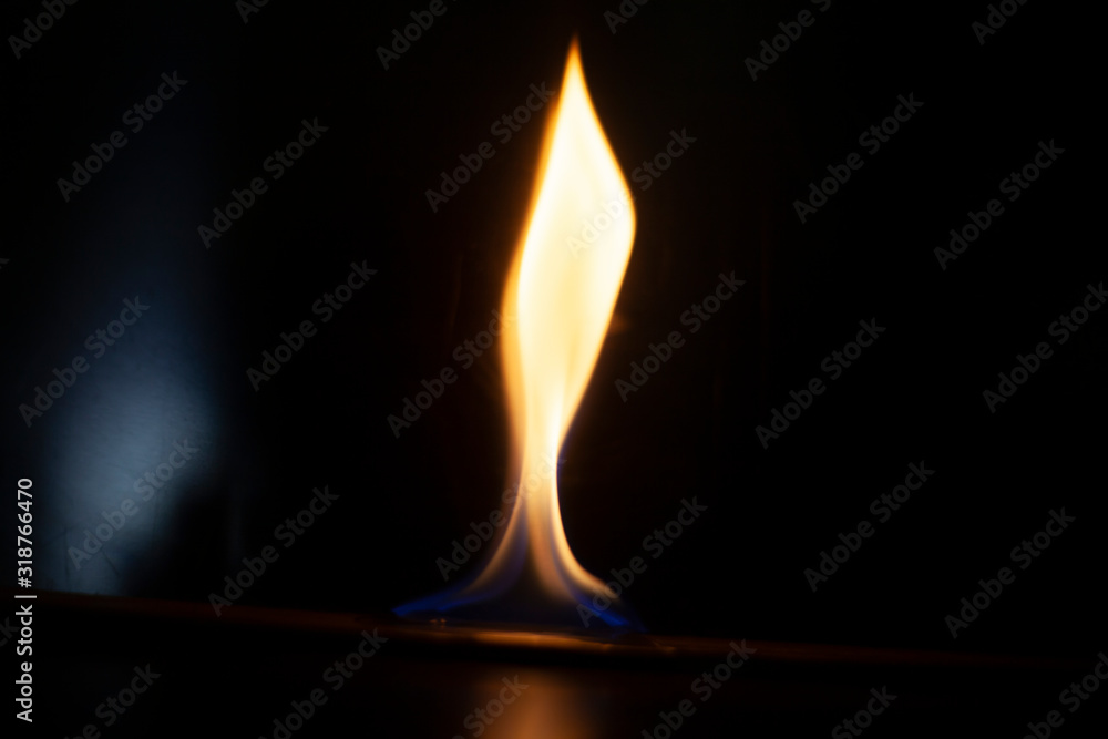 Tongue of fire flame in the dark. Ignition of oxygen in space. Fiery background. Fire of ether in the absence of light. Abstract fire heat background. Single fire. The ignition gel is on. Tongue of fire flame in the dark. Ignition of oxygen in space. Fiery background. Fire of ether in the absence of light. Abstract fire heat background. Single fire. The ignition gel is on.