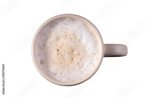 Latte coffee in white cup with milk foam isolated on white. Top view