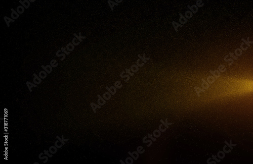 Glowing golden abstract bokeh glitter lights background of flickering gold particles and light flare