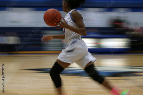 fast break during a girls high school basketball game © Ron Alvey