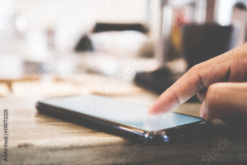 Wallpaper Mural Woman hand use smartphone to do work business, social network, communication with white screen as copyspace. Torontodigital.ca