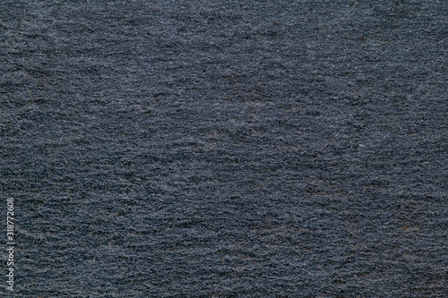 Dark gray colored slate stone texture. Clean stone surface with good details. Structre of natural slate stone slab. Macro shot. photo