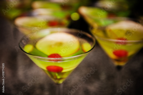 Apple martini's being served at an event photo