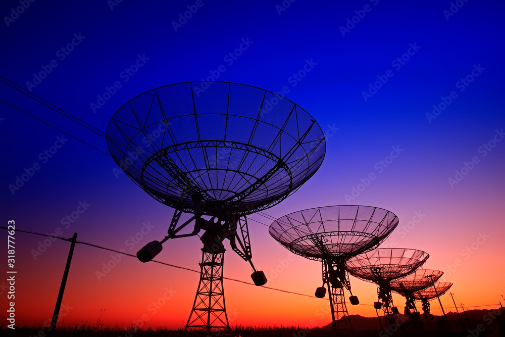 The silhouette of a radio telescope observatory The silhouette of a radio telescope observatory