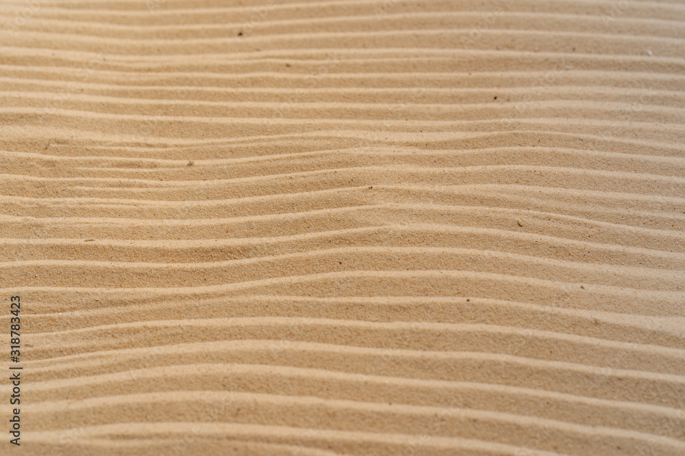 Textured yellow sand on the beach Textured yellow sand on the beach