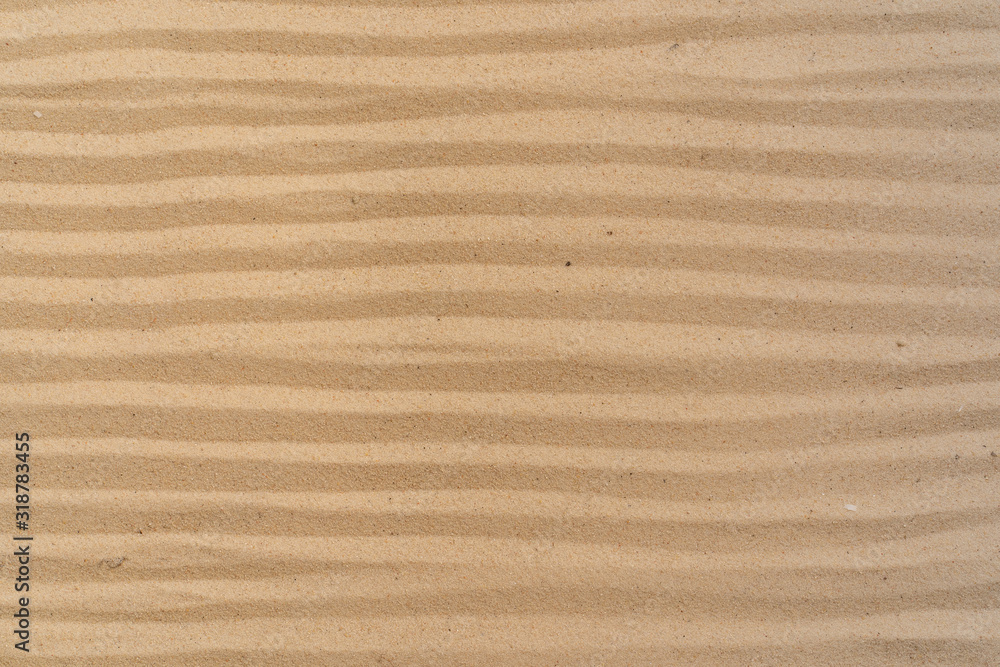 Textured yellow sand on the beach Textured yellow sand on the beach