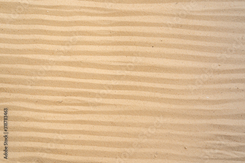 Textured yellow sand on the beach