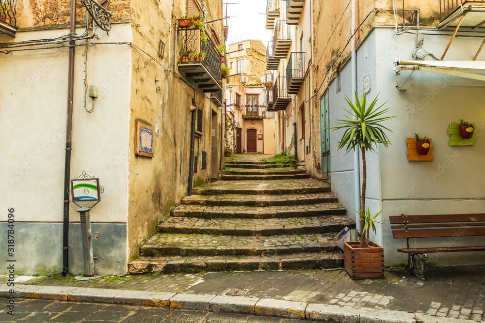 Italy, Sicily, Palermo Province, Castelbuono. Stairs on a narrow side street in the town of Castelbuono.
