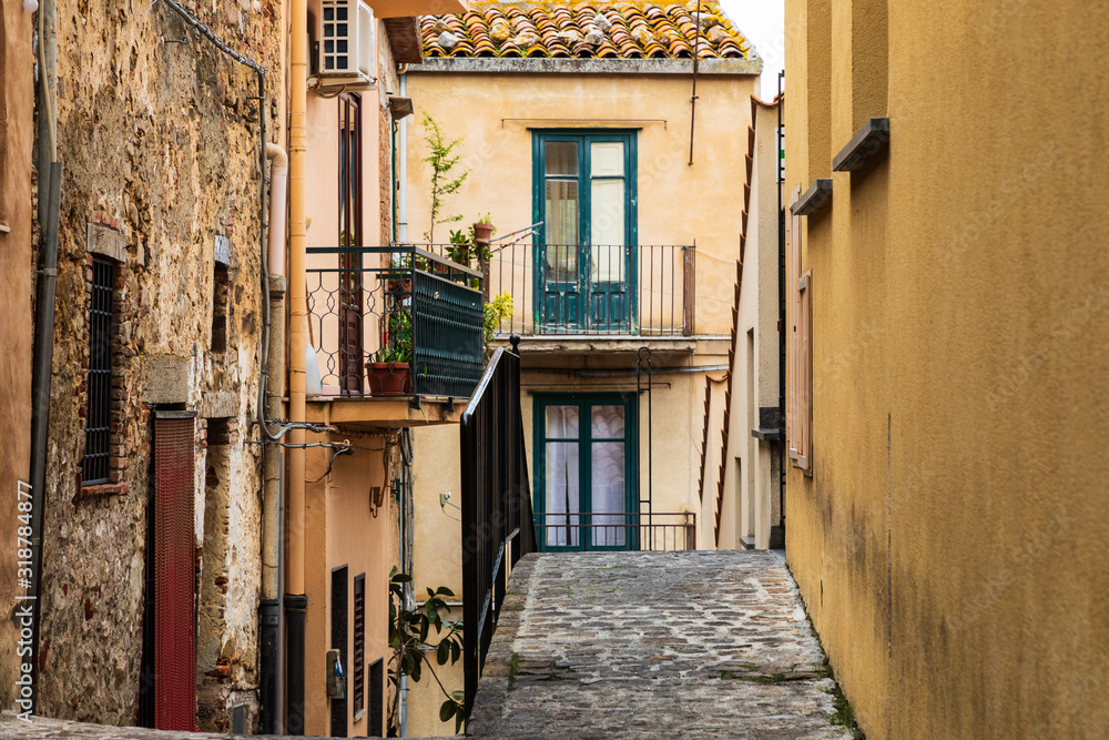 Italy, Sicily, Palermo Province, Castelbuono. Narrow village cobblestone street in Castelbuono.
