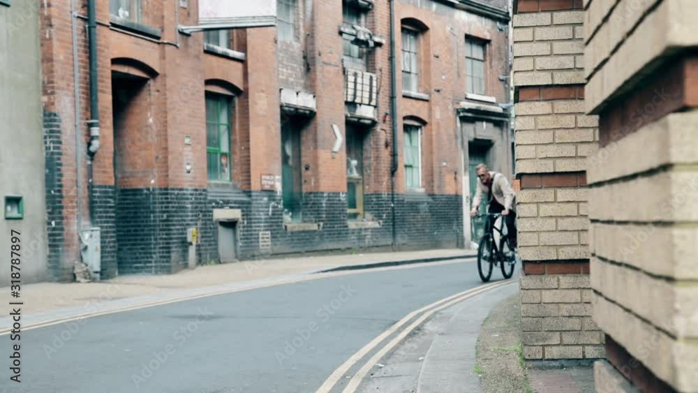 Businessman riding bicycle in London Businessman riding bicycle in London