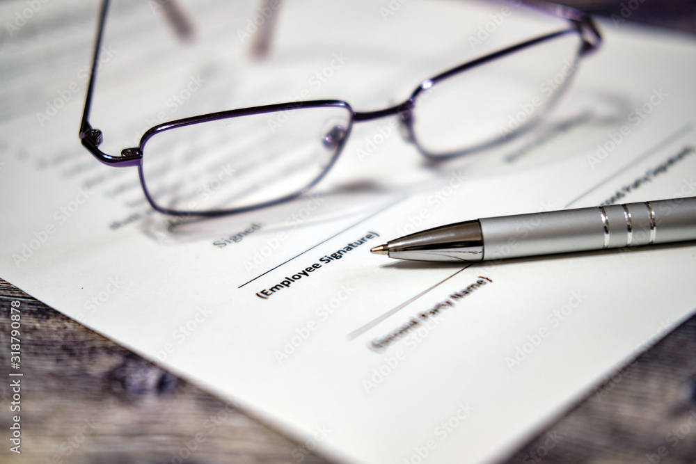 Pen for signature contract. Business concept with glasses Pen for signature contract. Business concept with glasses