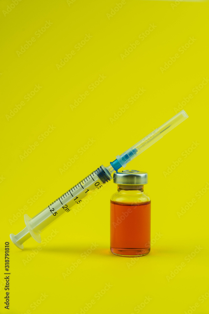 Medicine bottle for injection. Medical glass vials and syringe for vaccination. Liquid red drug or vaccine for treatment, flu in laboratory, hospital, healthcare, or pharmacy concept, isolated Medicine bottle for injection. Medical glass vials and syringe for vaccination. Liquid red drug or vaccine for treatment, flu in laboratory, hospital, healthcare, or pharmacy concept, isolated