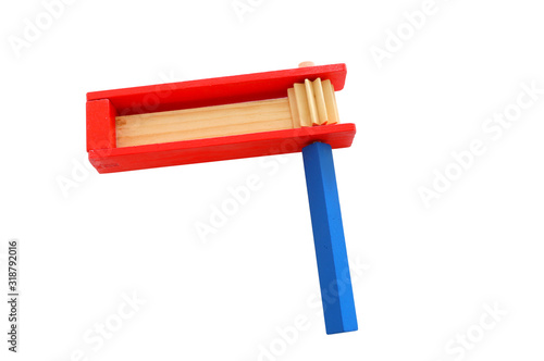 wooden colorful noisemaker or gragger for purim celebration holiday (jewish holiday) isolated on white