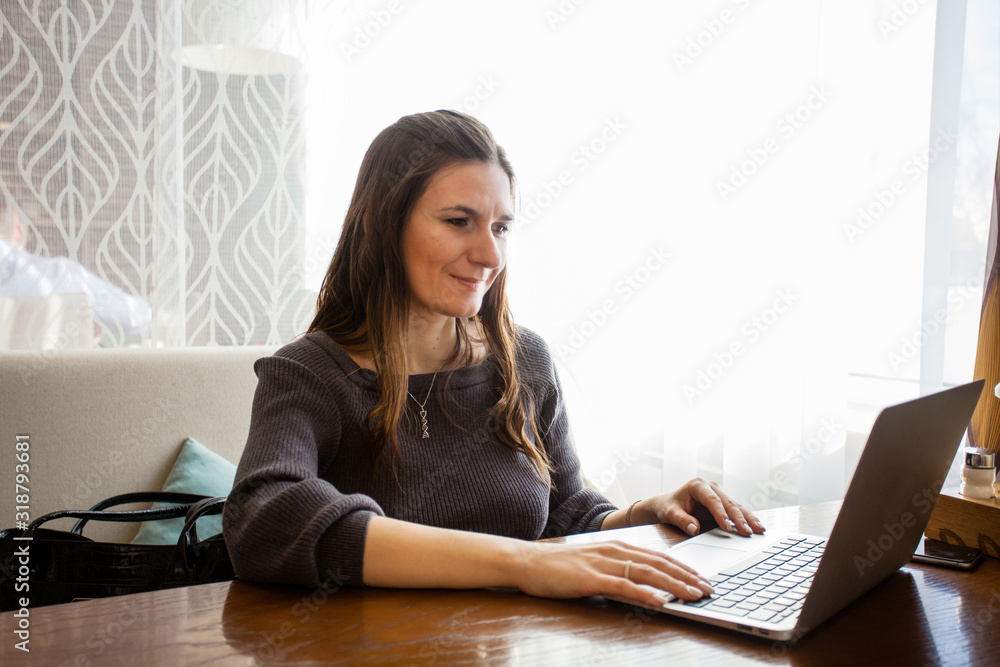 Woman working at a computer, freelancer or Manager, self-employed, business Woman working at a computer, freelancer or Manager, self-employed, business