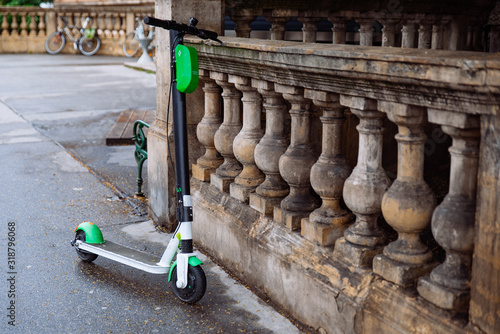 Photography parked electric scooters at city street