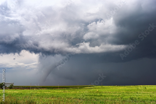 Tornado with dark storm clouds