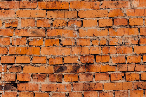 Background of orange and brown brick wall texture