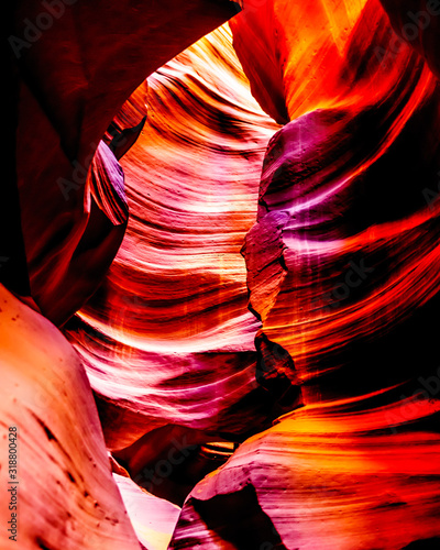 The smooth curved Red Navajo Sandstone walls of the Upper Antelope Canyon, one of the famous Slot Canyons in the Navajo lands near Page Arizona, United States photo