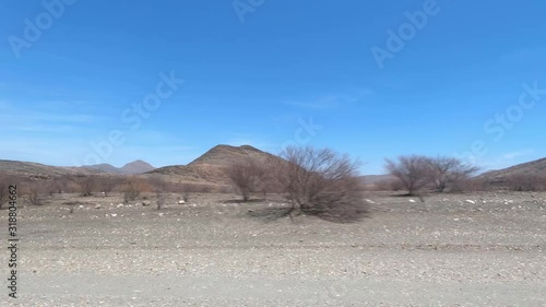 Driving On Namibias Gravel Roads, Side View photo