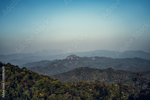 landscape mountains forests sky in the evening