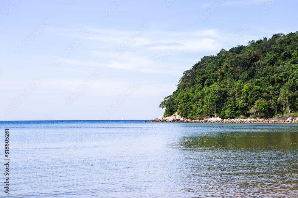 Green island with clear blue sky and blue sea water, nature concept background, summer holiday destination, beautiful Phuket island in South of Thailand