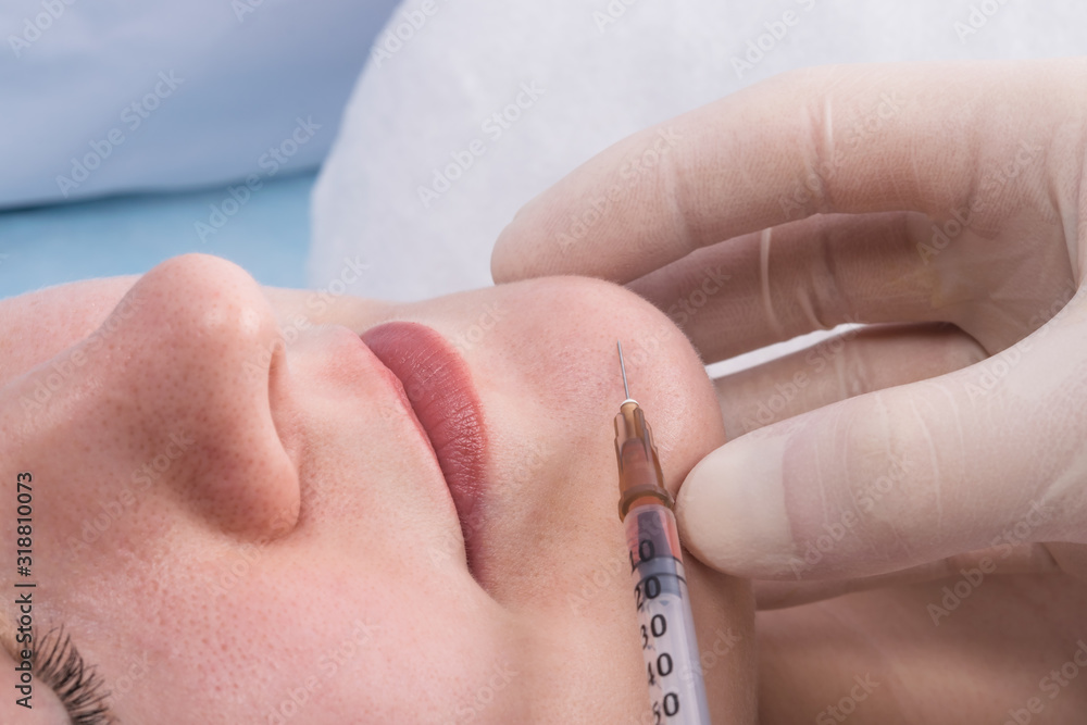 facial treatments: an injection for smoothing wrinkles and correcting the chin