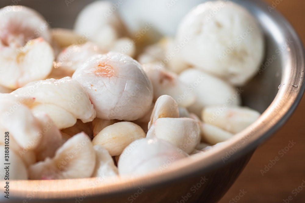 Mangosteen flesh out of its shell in a metal bowl. Mangosteen flesh out of its shell in a metal bowl.